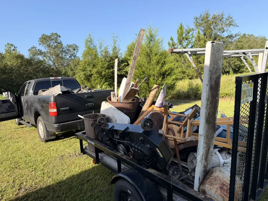 Trailer packed with furniture, scrap and yard debris after a large junk removal job in the Florida Panhandle